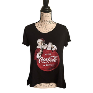 front of coca cola black shirt with Santa