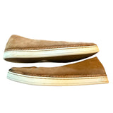 Side view of brown suede Ugg shoes