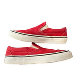 Side view of red shoes