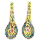 2 chinese yellow longevity spoons front